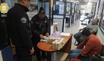 Mujer detenida con 5 mdp en efectivo en el AICM