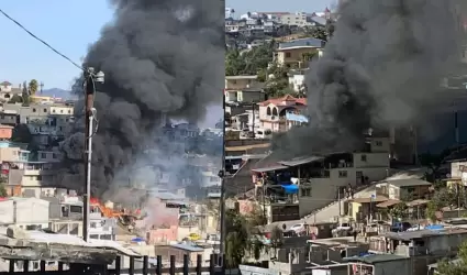 Bomberos rescatan a dos personas atrapadas en el fuego en viviendas en Lomas Tau