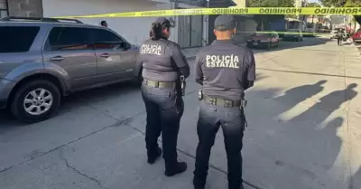 Polic�a muere tras dispararse