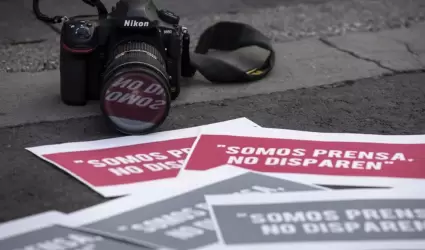 Periodistas.